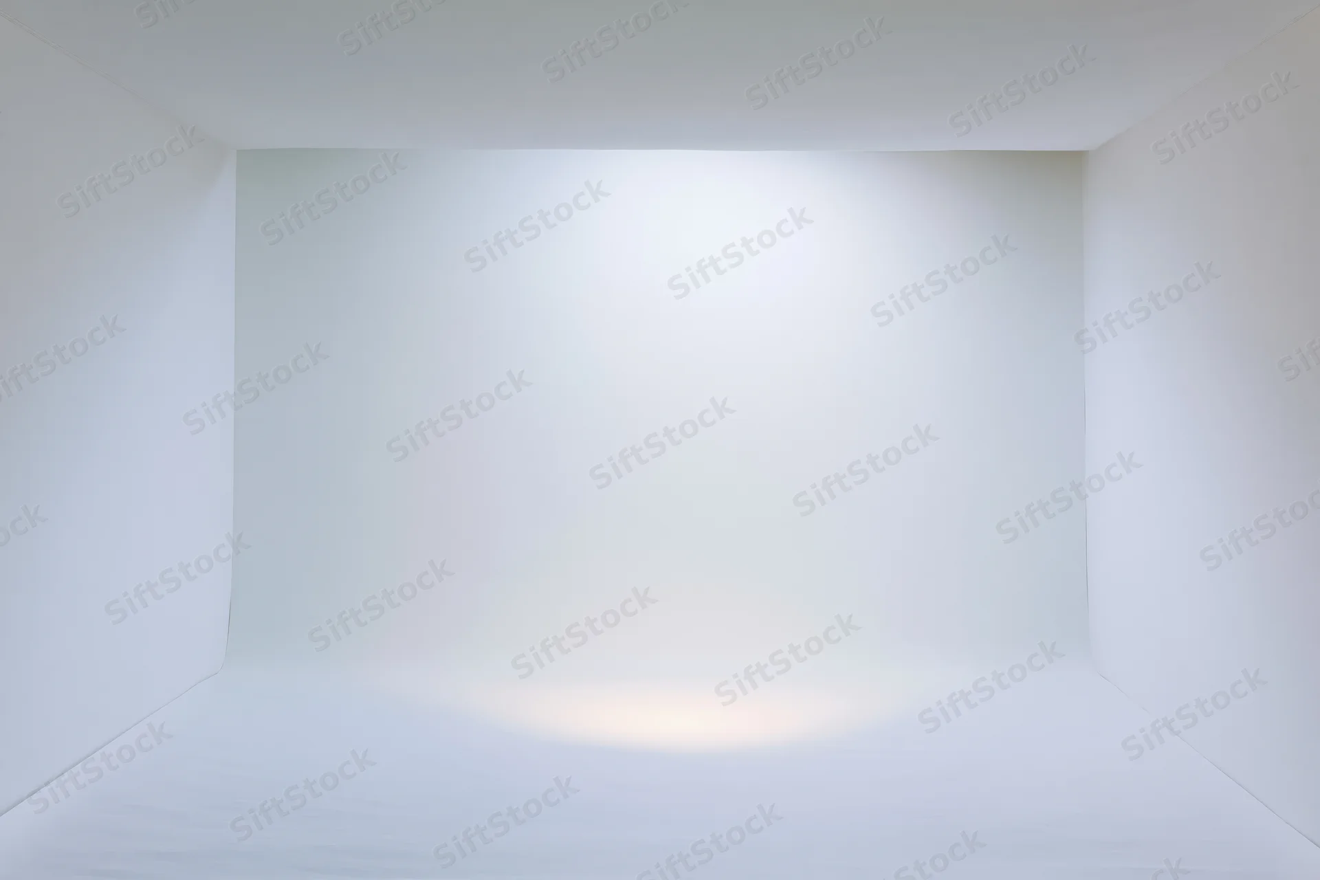 Seamless white paper backdrop in a photography studio interior