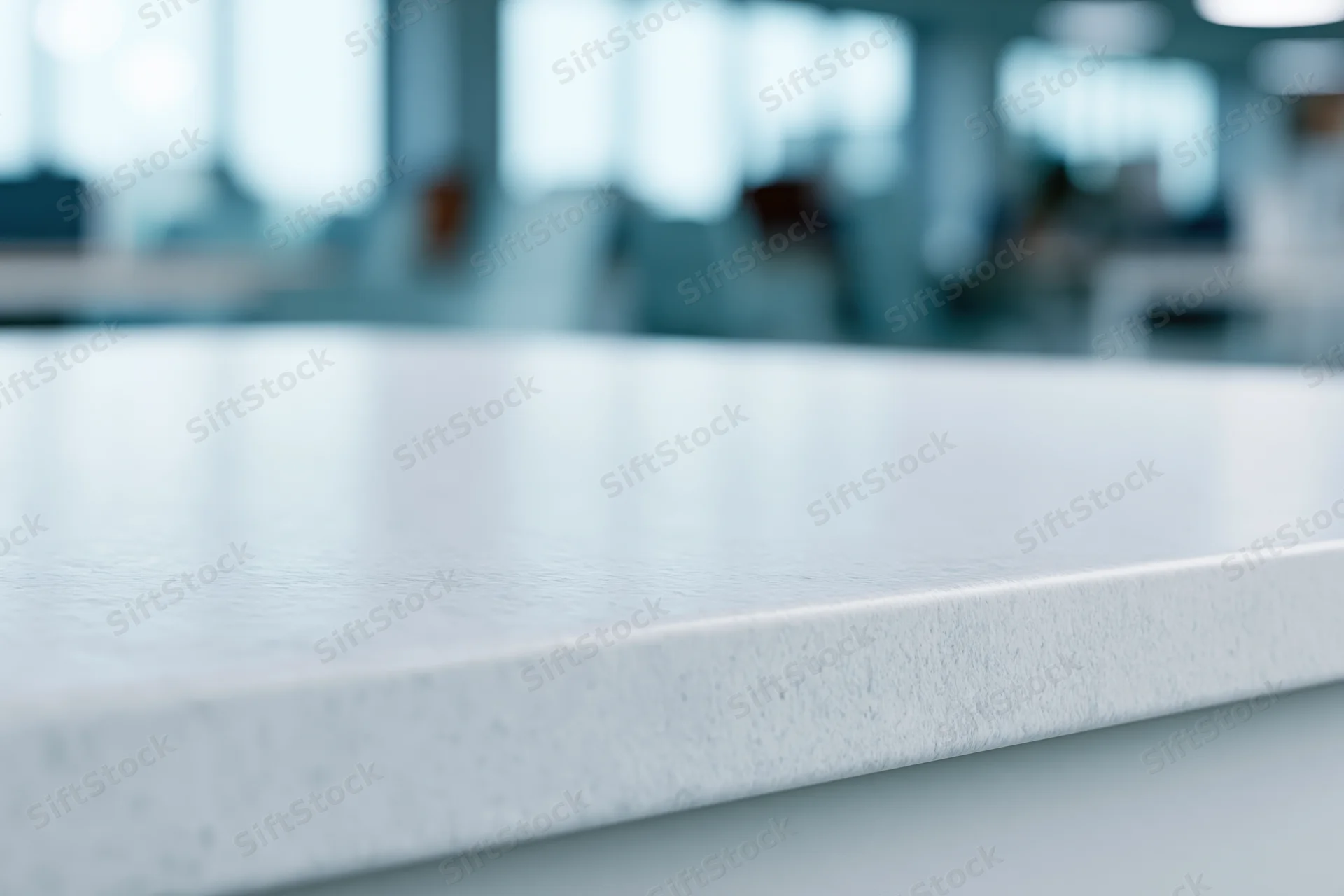 White textured tabletop surface in office interior with blurred background