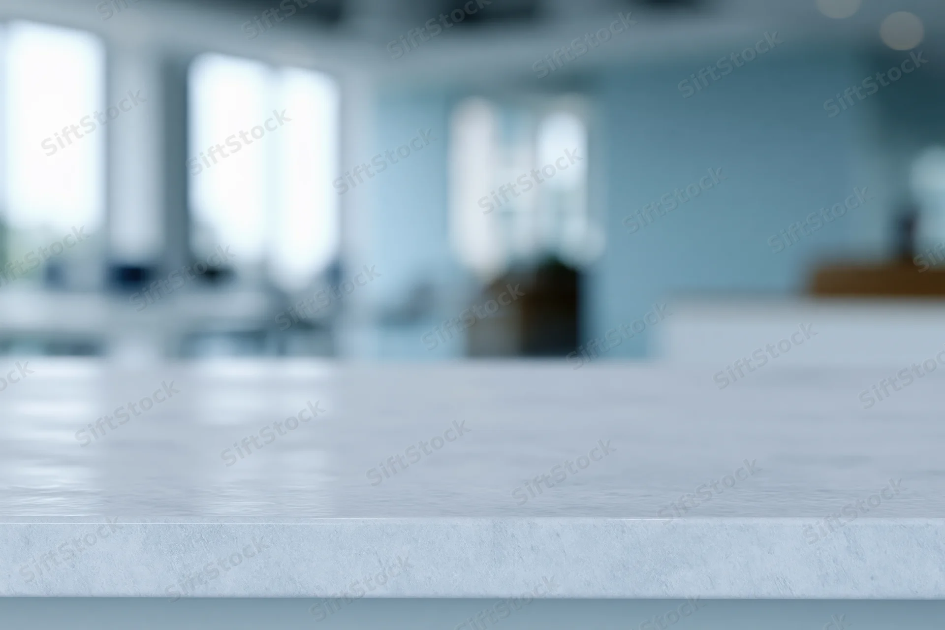 White textured tabletop surface in foreground with blurred interior background
