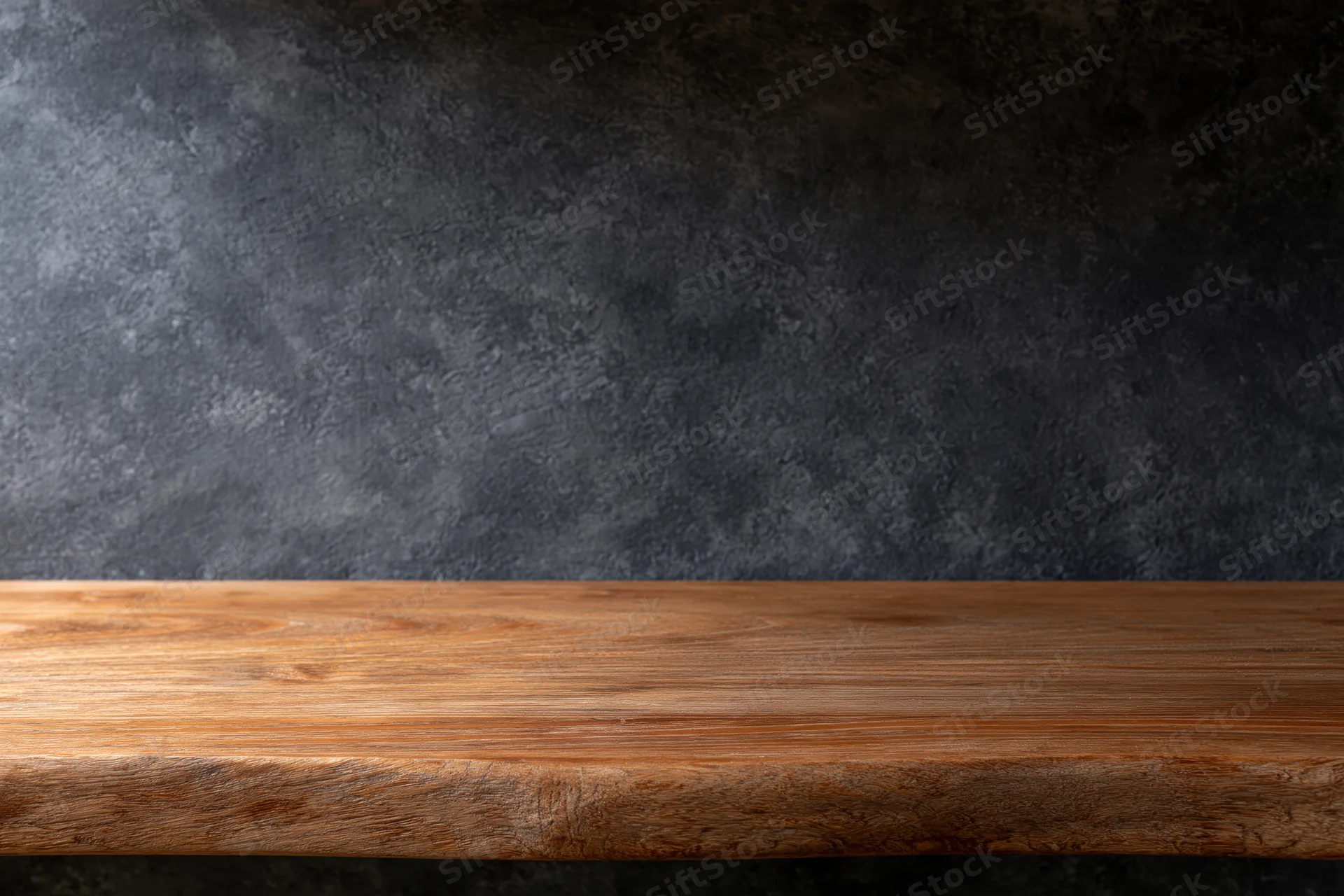 Empty wooden shelf against dark textured wall with copyspace for product display