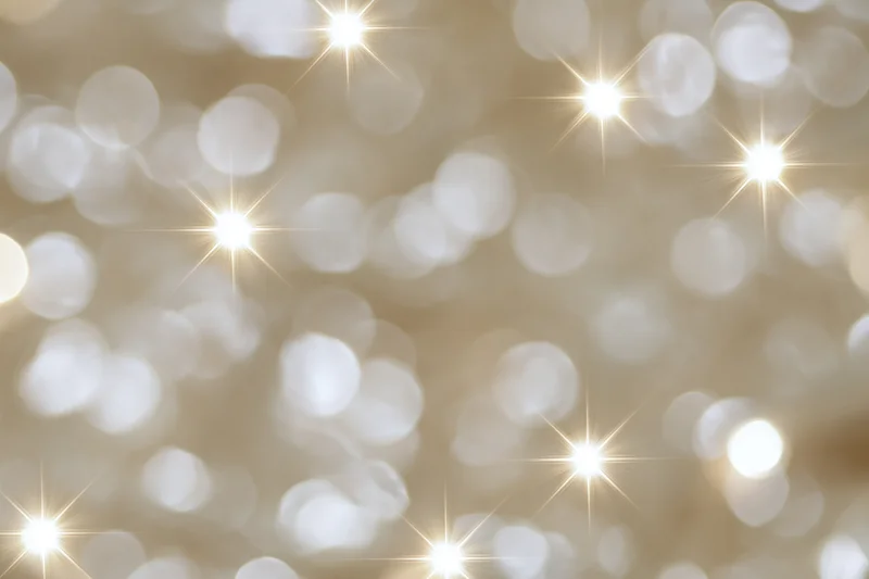 Abstract bokeh background of out-of-focus holiday lights with golden sparkle and soft glow