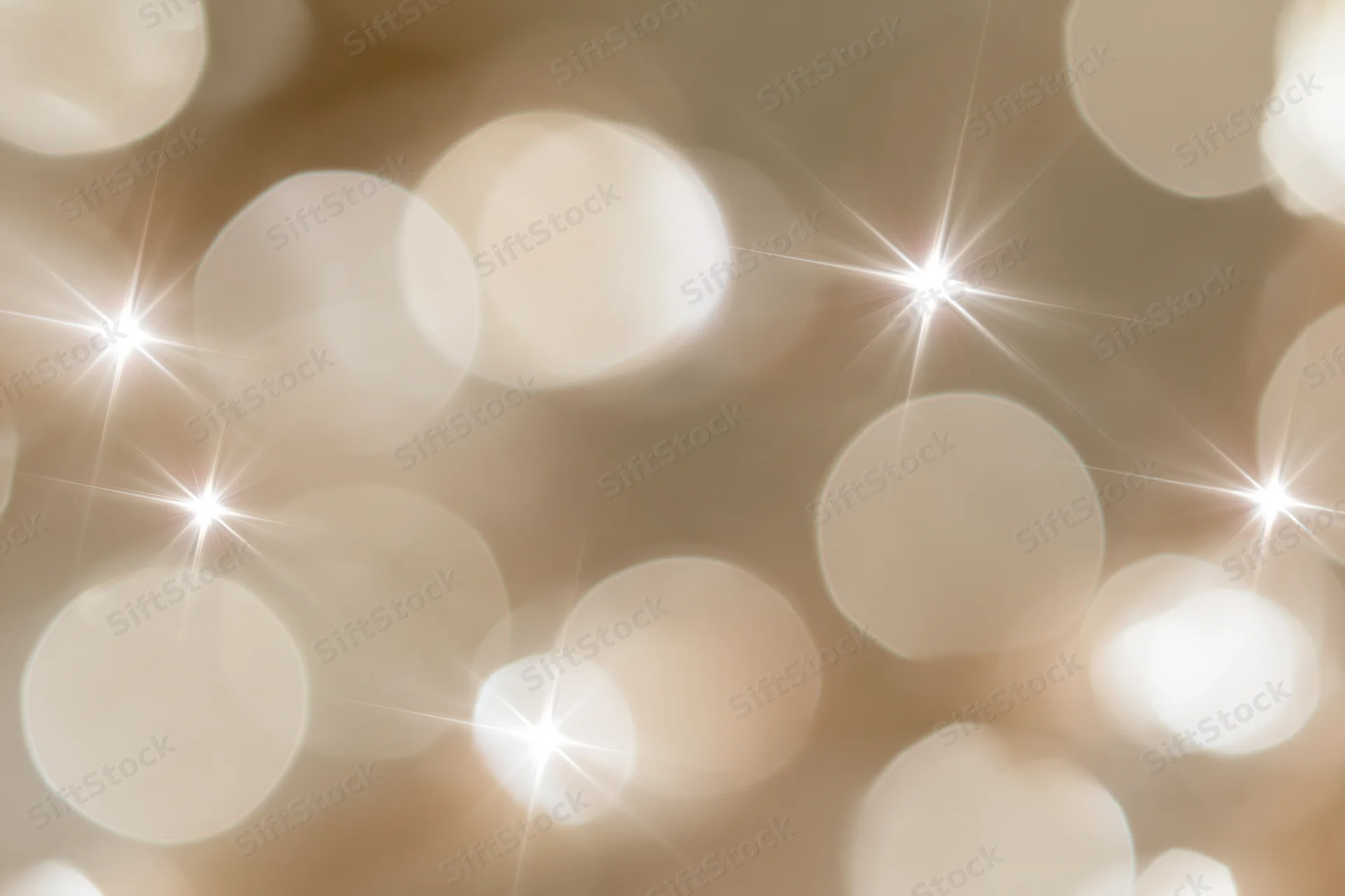 Abstract bokeh lights with starbursts and soft glow for holiday background