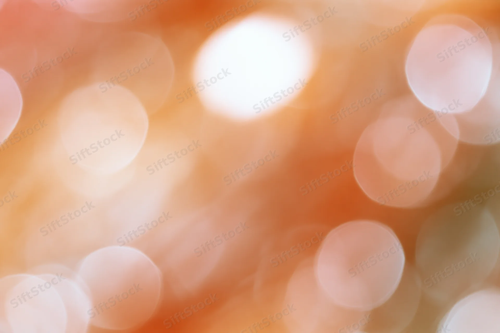 Warm bokeh lights blurred in soft focus as abstract background