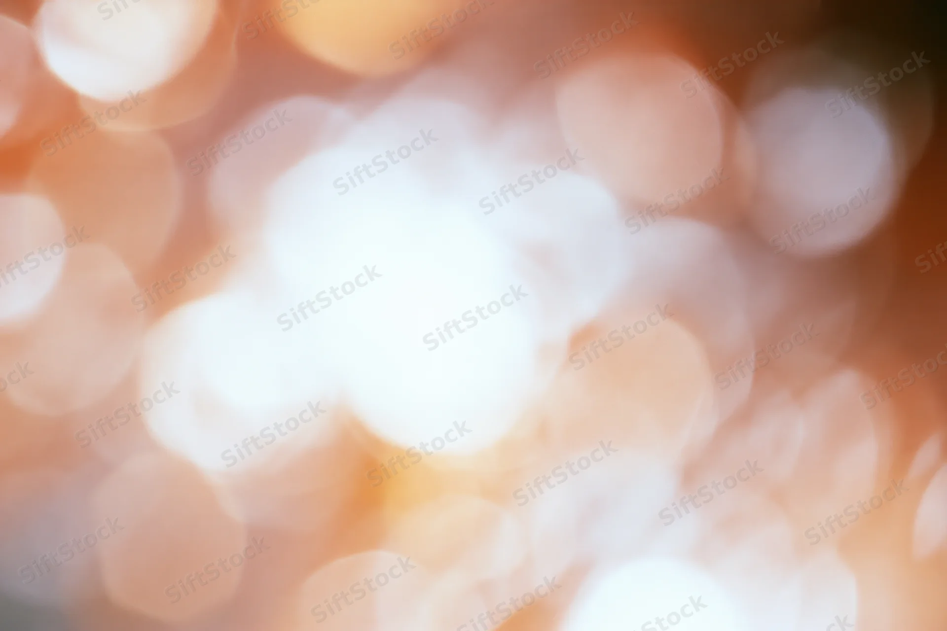 Warm bokeh lights blurred in soft focus as background