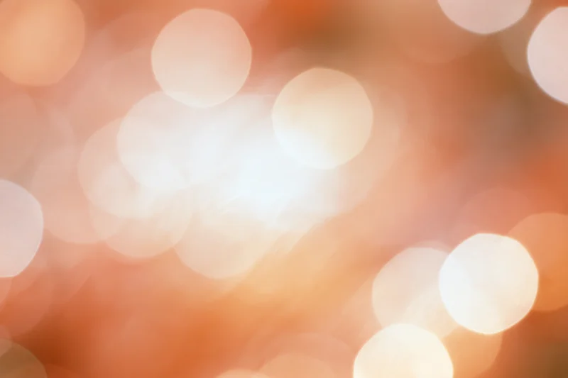 Warm bokeh lights blurred in soft glow with circular highlights