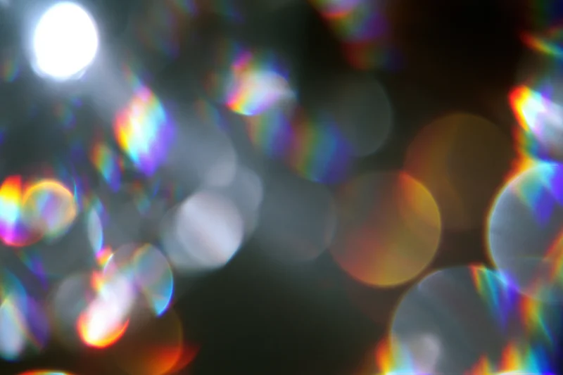 Abstract light scatter with rainbow bokeh and lens flare effects