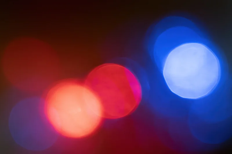 Blurred red and blue emergency lights at night
