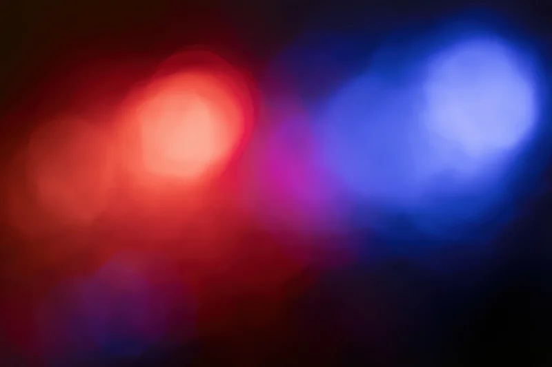 Blurred red and blue emergency lights at night