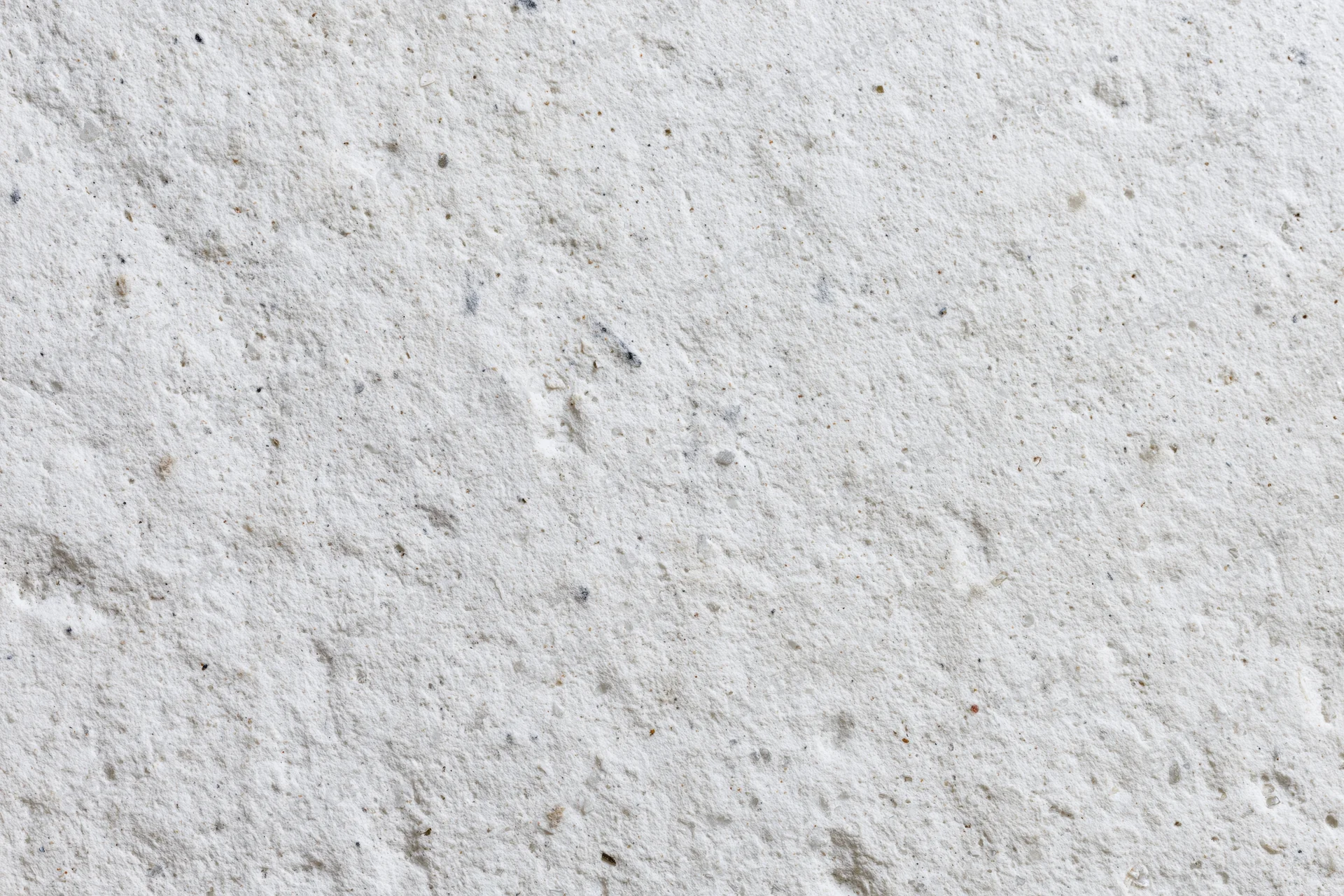 Flat concrete wall surface filling the frame with rough texture and gray tone