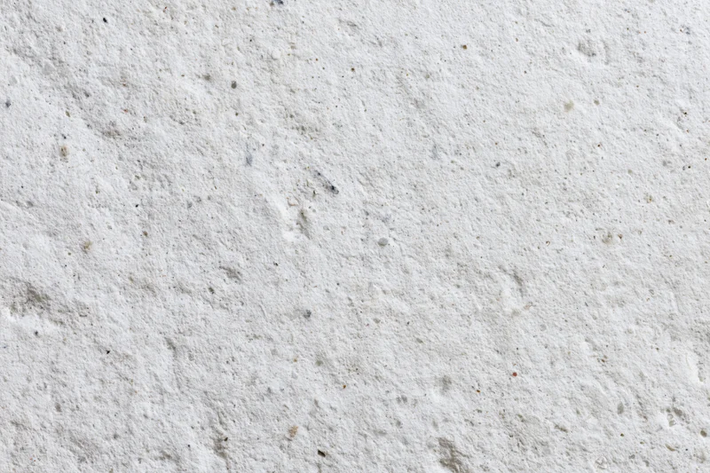 Flat concrete wall surface filling the frame with rough texture and gray tone