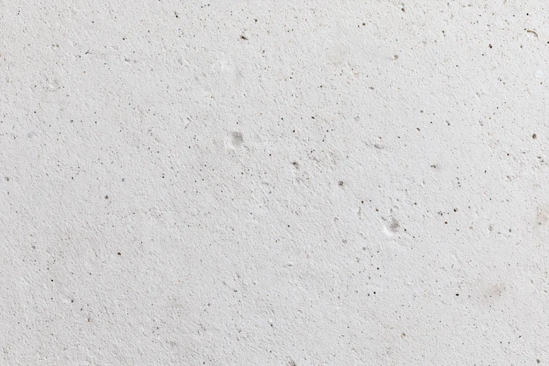 Flat concrete wall surface filling the frame with rough texture and gray tone