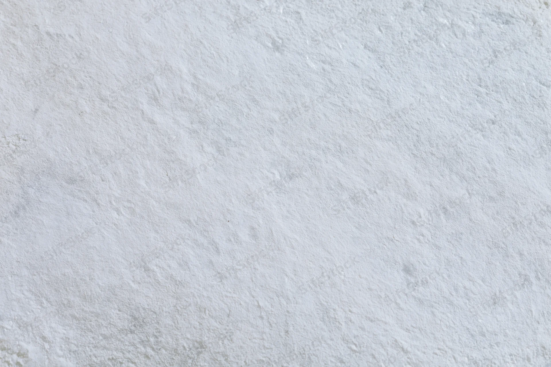 Flat concrete wall surface filling the frame with rough texture and gray tone