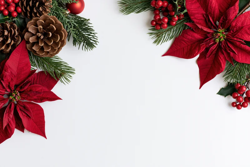 Flat lay Christmas corner border arrangement with red poinsettia