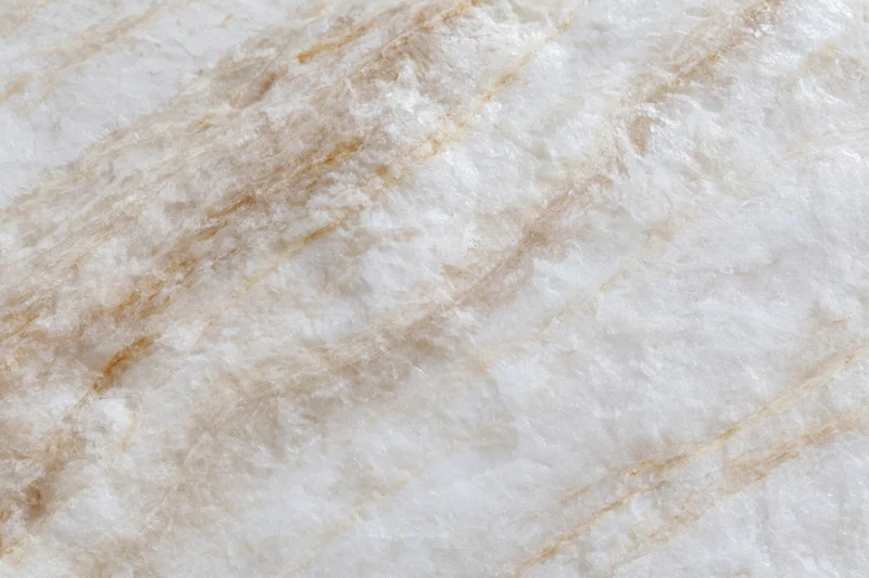 Polished marble stone surface with natural veining filling the frame in flat lay closeup