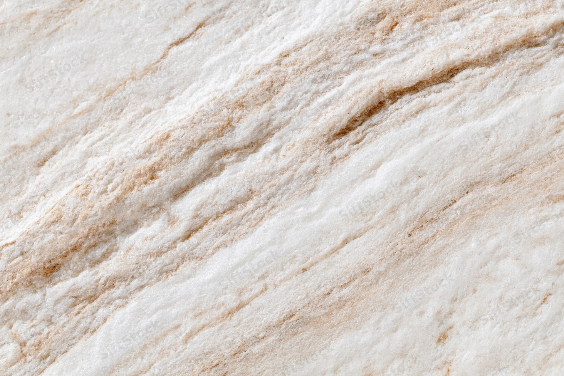 Polished marble stone surface with natural veining filling the frame