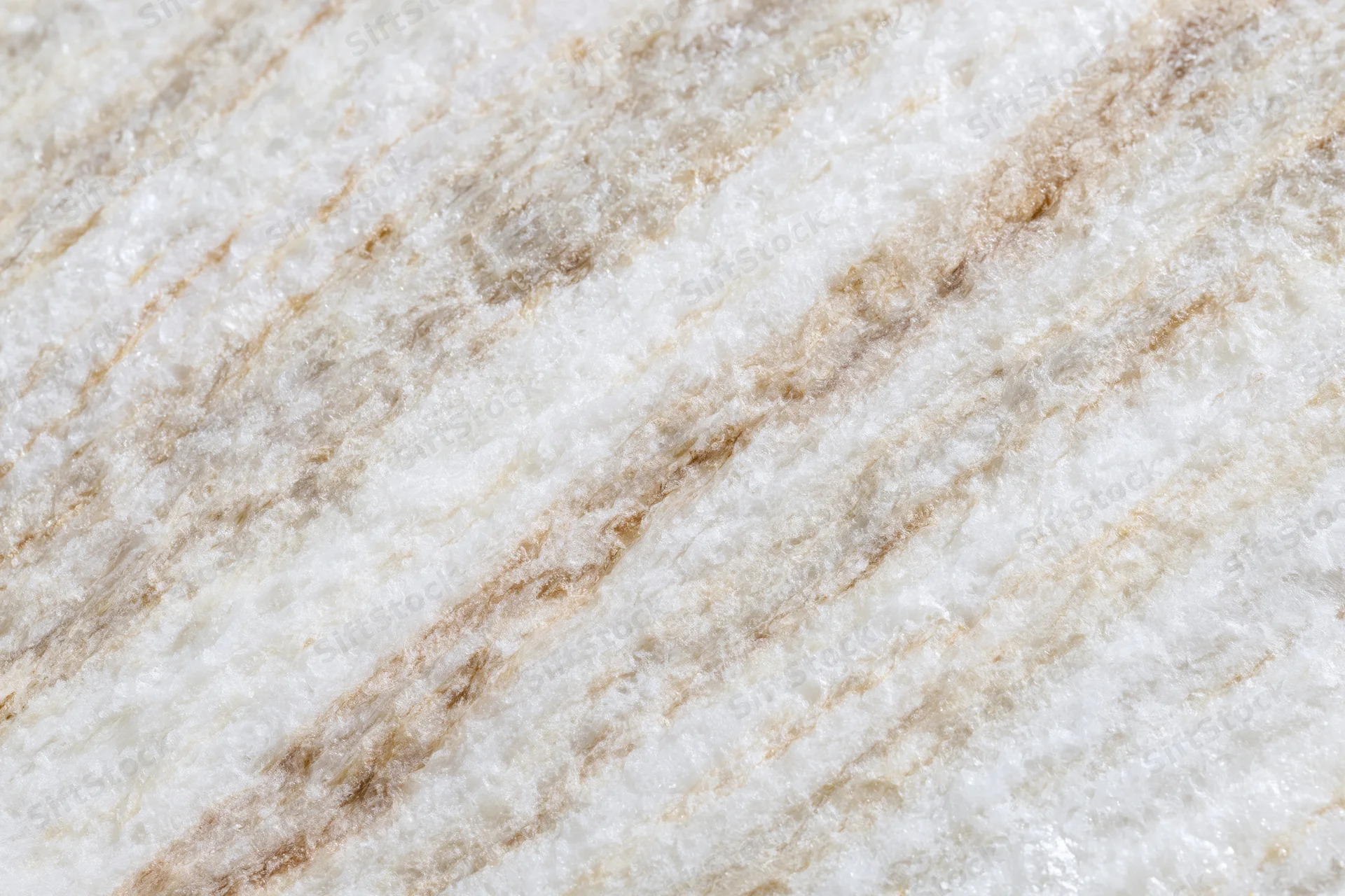 Polished marble stone surface with natural veining filling the frame