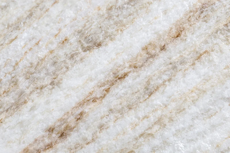 Polished marble stone surface with natural veining filling the frame
