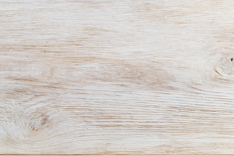 Whitewashed wooden board surface in flat lay closeup view