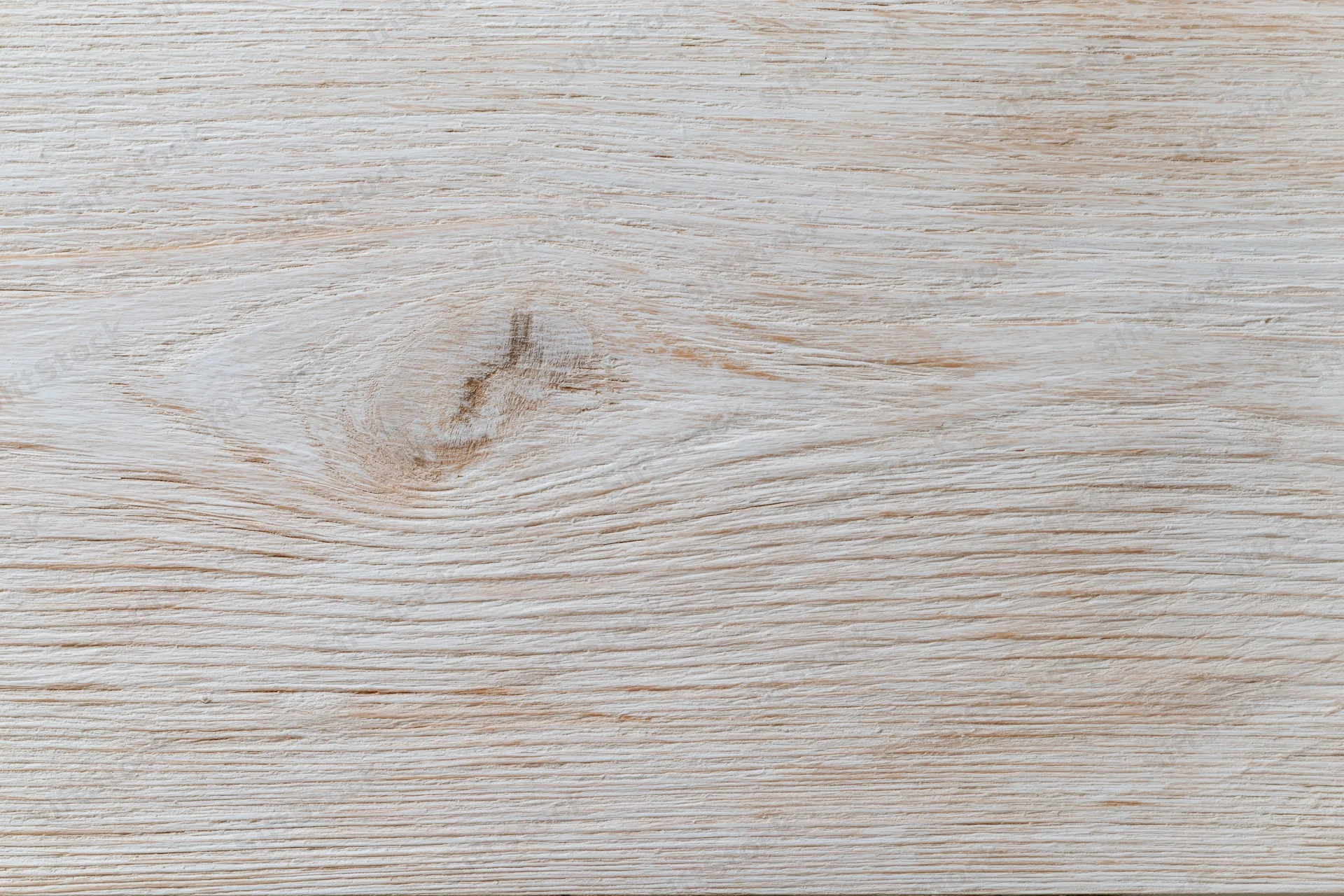 Close-up of a whitewashed wooden board surface with visible grain and knot, flat lay arrangement