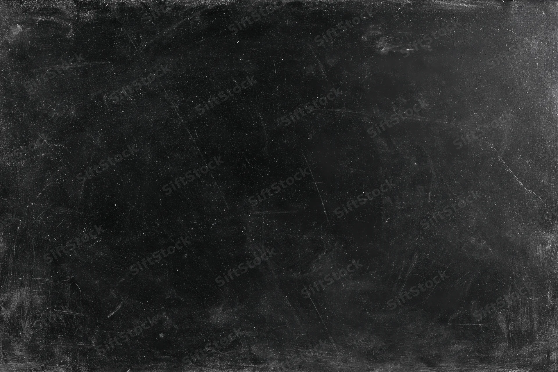 Worn black chalkboard surface with scratches and smudges, flat lay close-up, copyspace for text or design