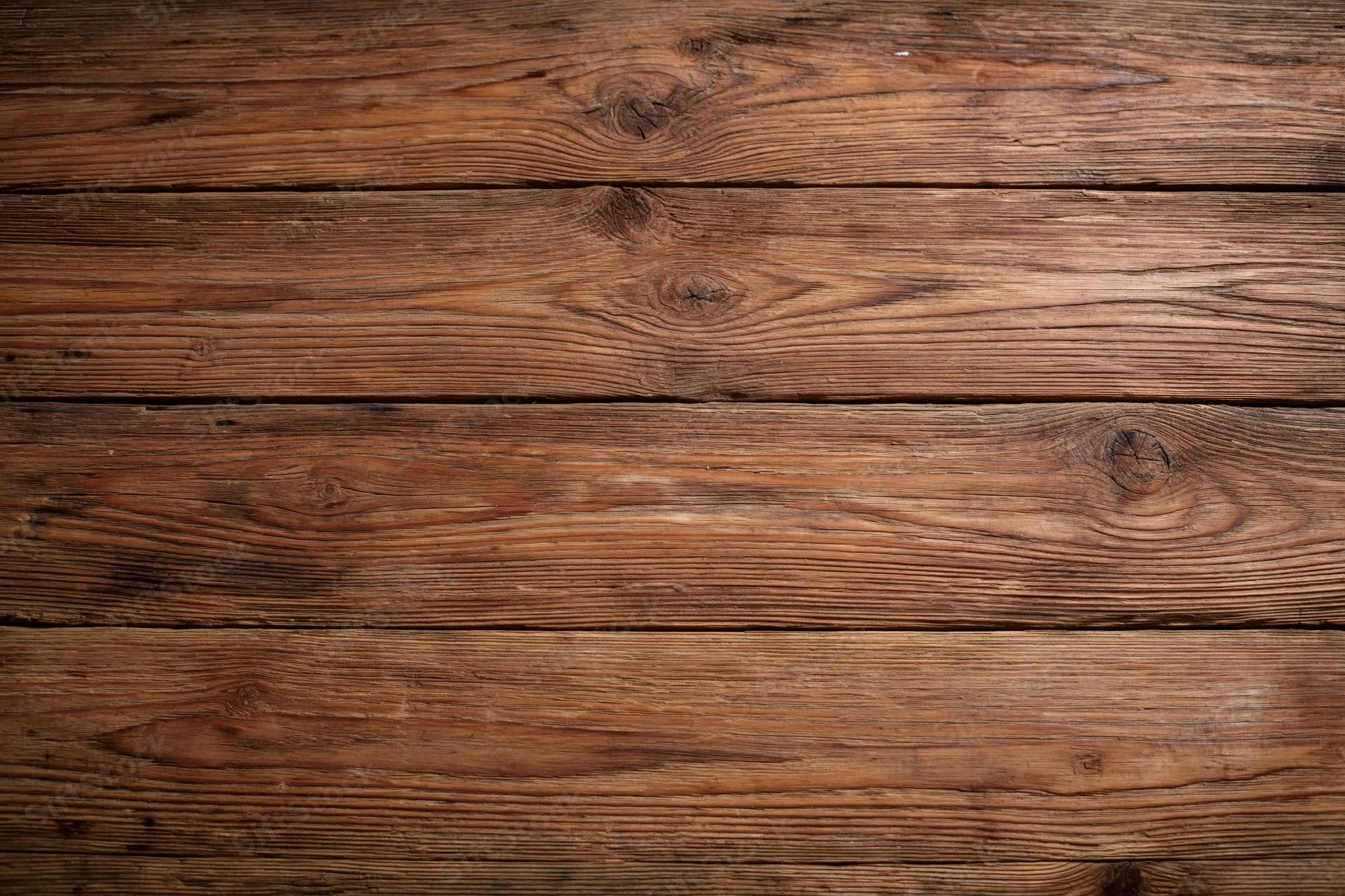 Aged horizontal wooden planks arranged in a flat lay filling the frame