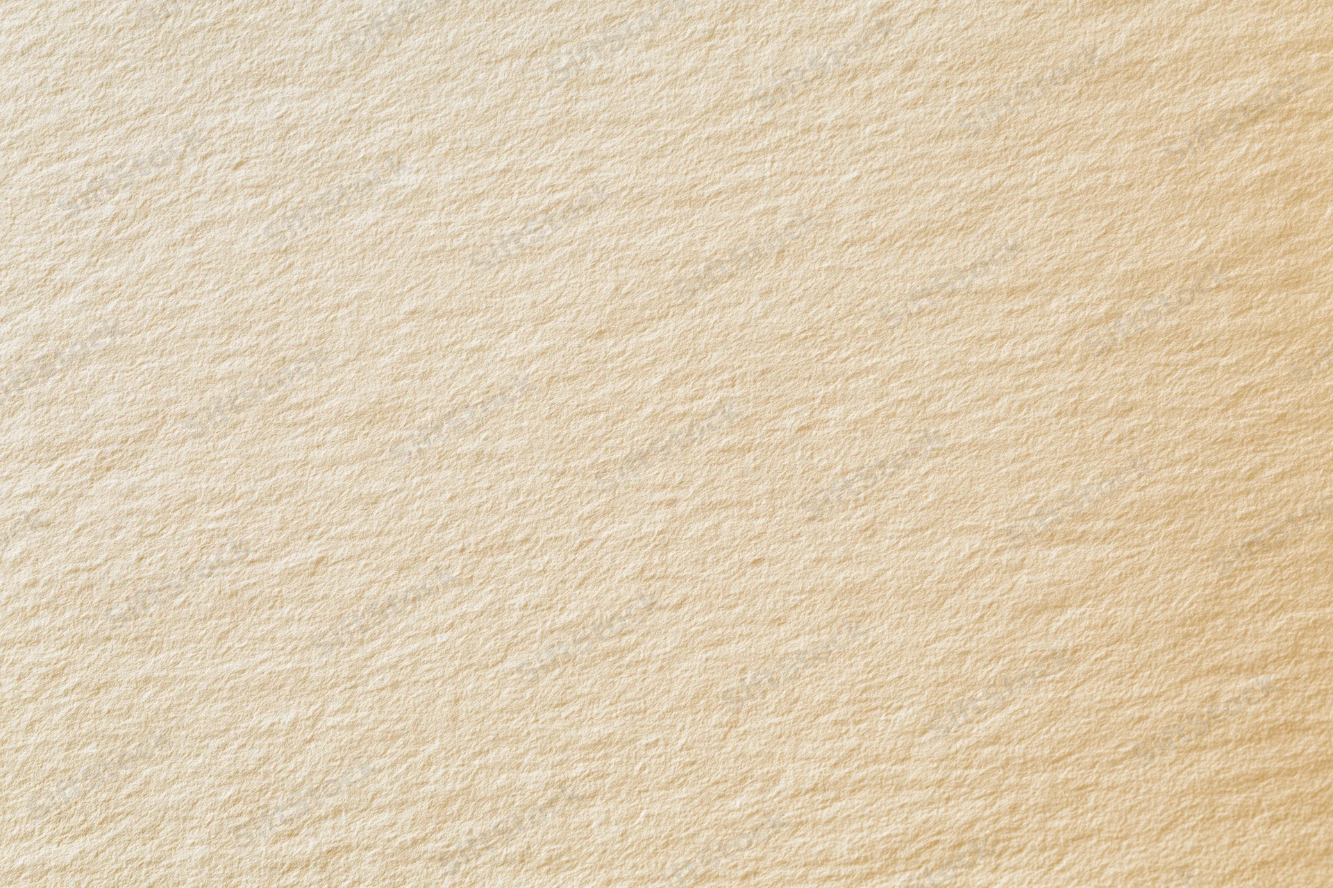 Close-up of smooth cream-colored paper surface with visible texture and fiber pattern