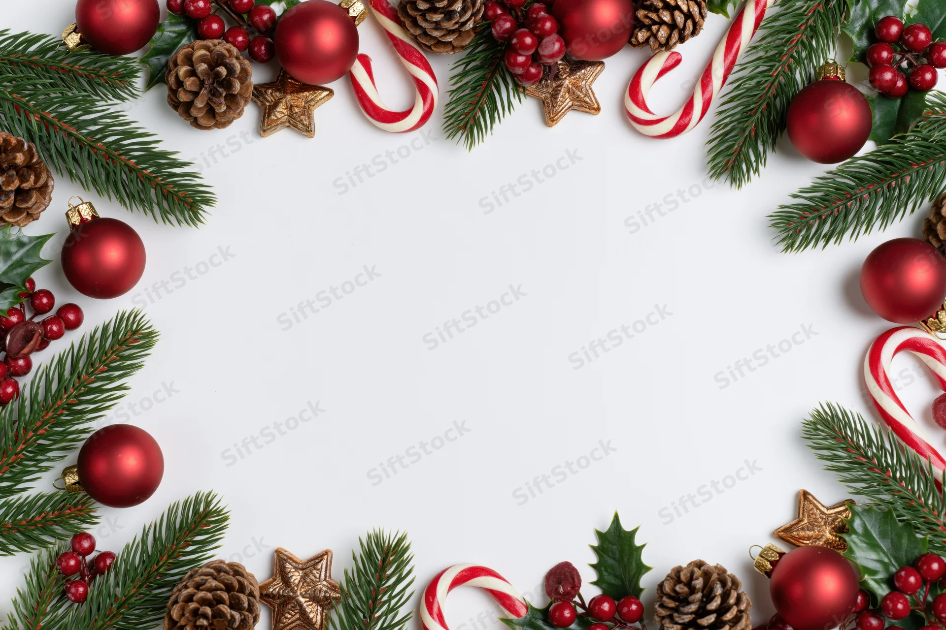 Christmas decorations arranged as a border frame on white background with copyspace