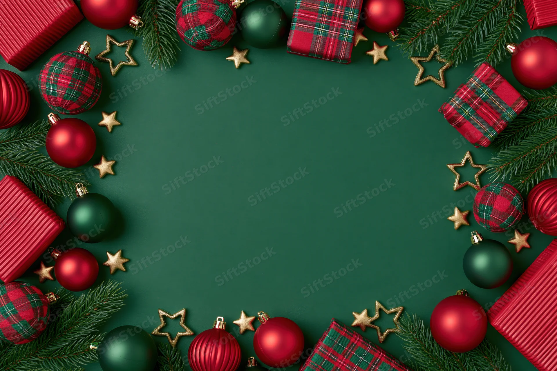 Christmas ornaments and wrapped gifts arranged in a flat lay frame with pine branches and gold stars on green background