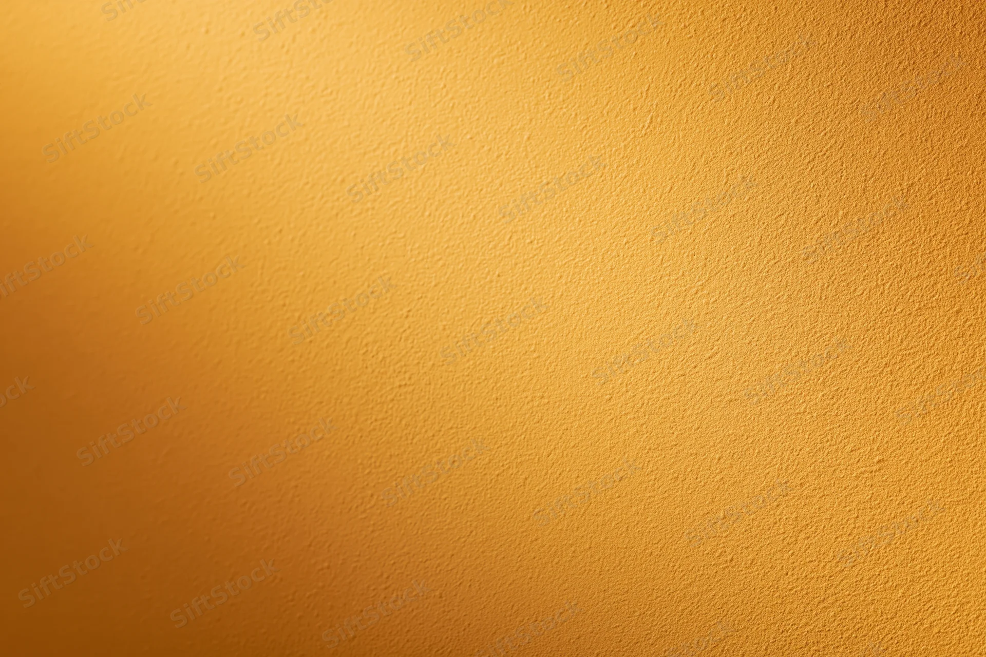 Flat orange painted wall surface filling the frame with smooth matte texture and warm gradient tone