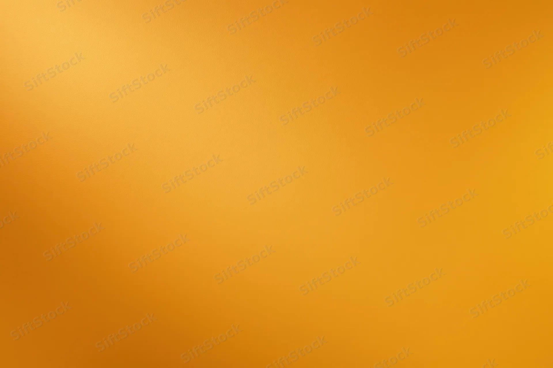 Smooth matte painted orange wall surface filling the frame