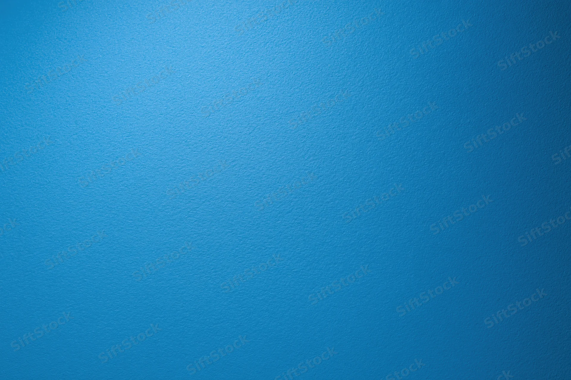 Solid blue textured surface filling the frame as a background