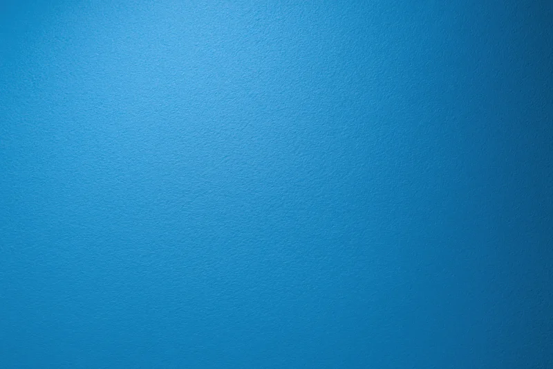 Solid blue textured surface filling the frame as a background