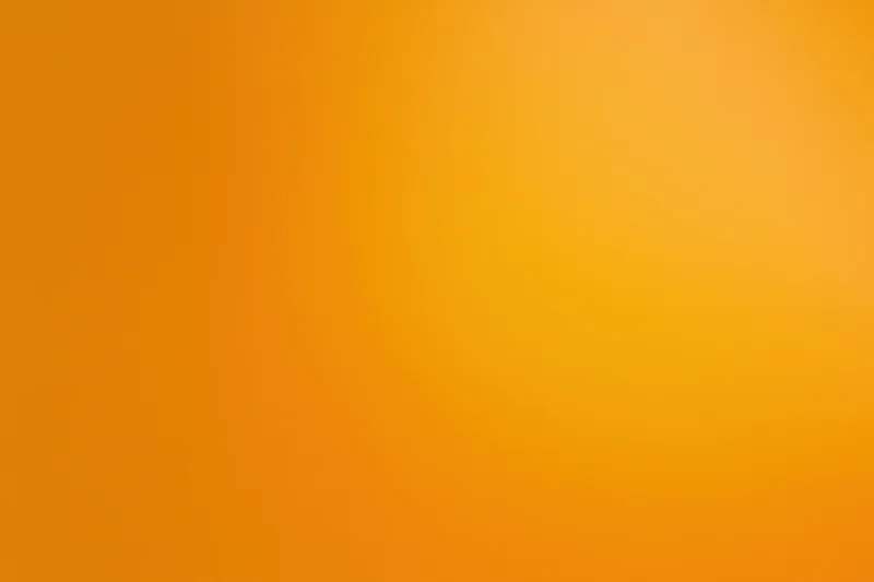 Warm amber-orange gradient background transitioning from light to dark across the frame