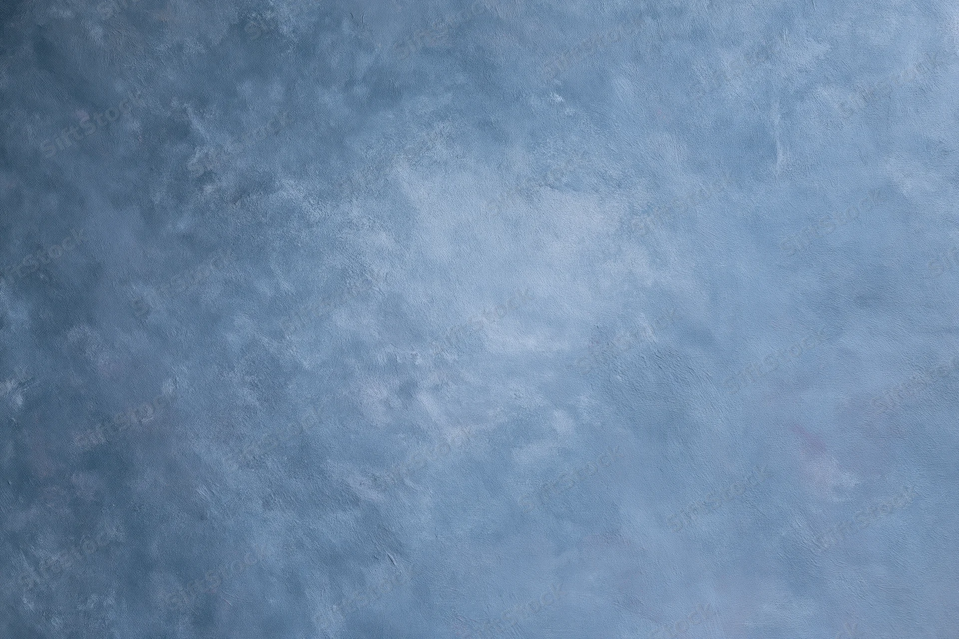 Hand-painted canvas backdrop with soft mottled blue texture for studio photography