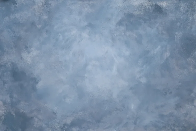 Hand-painted canvas backdrop with soft mottled blue and gray texture for photography studio use