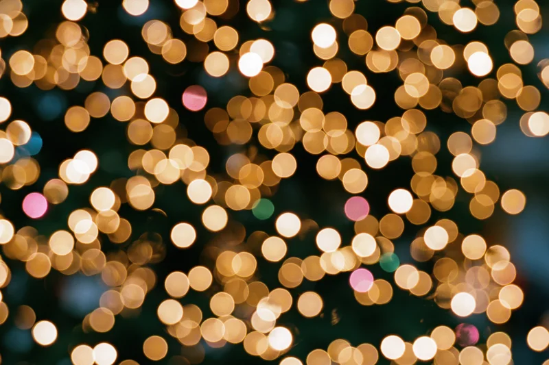 Defocused christmas tree lights glowing softly in the dark