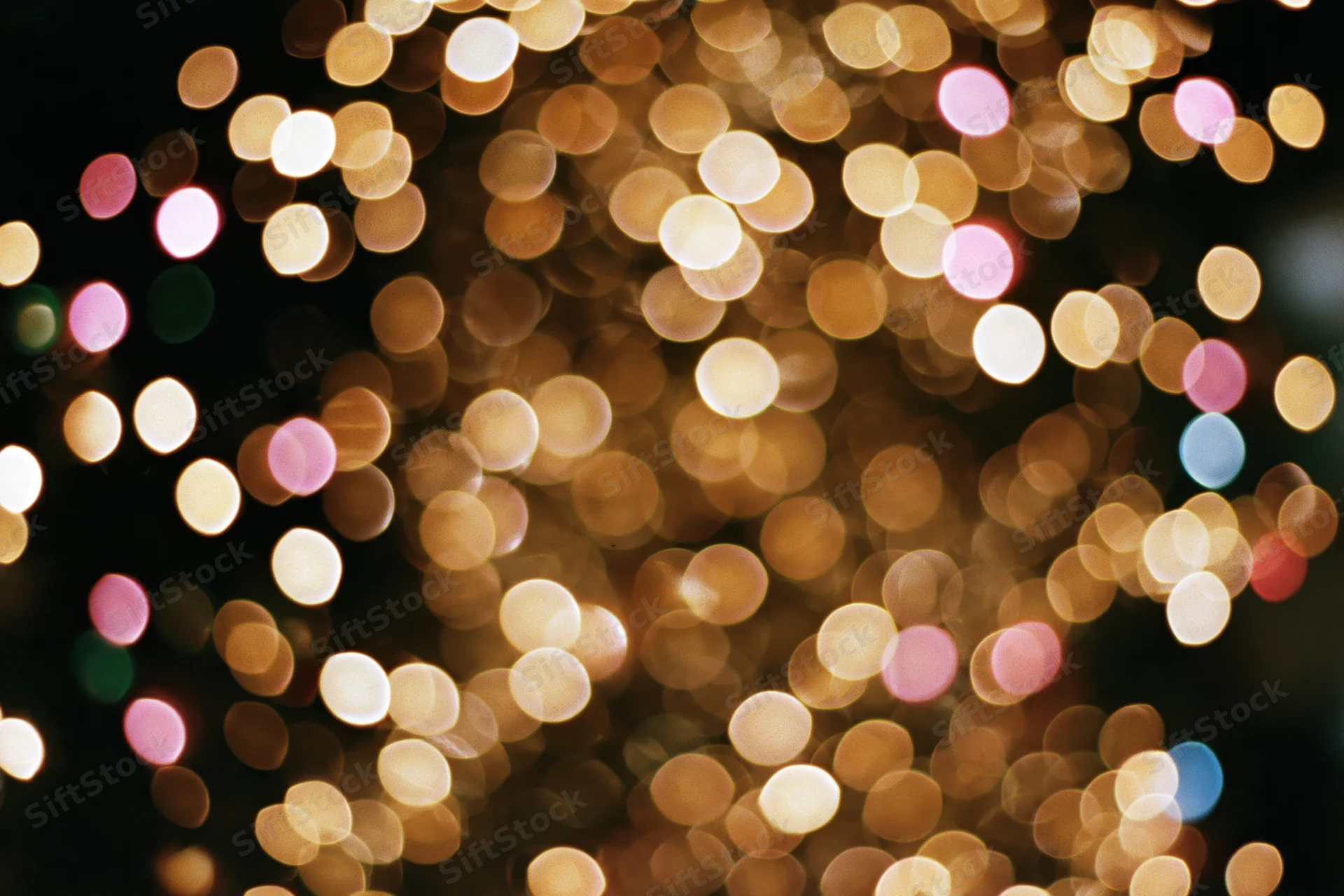 Defocused christmas tree lights glowing softly in the dark