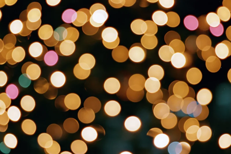 Defocused christmas tree lights glowing softly in the dark at night
