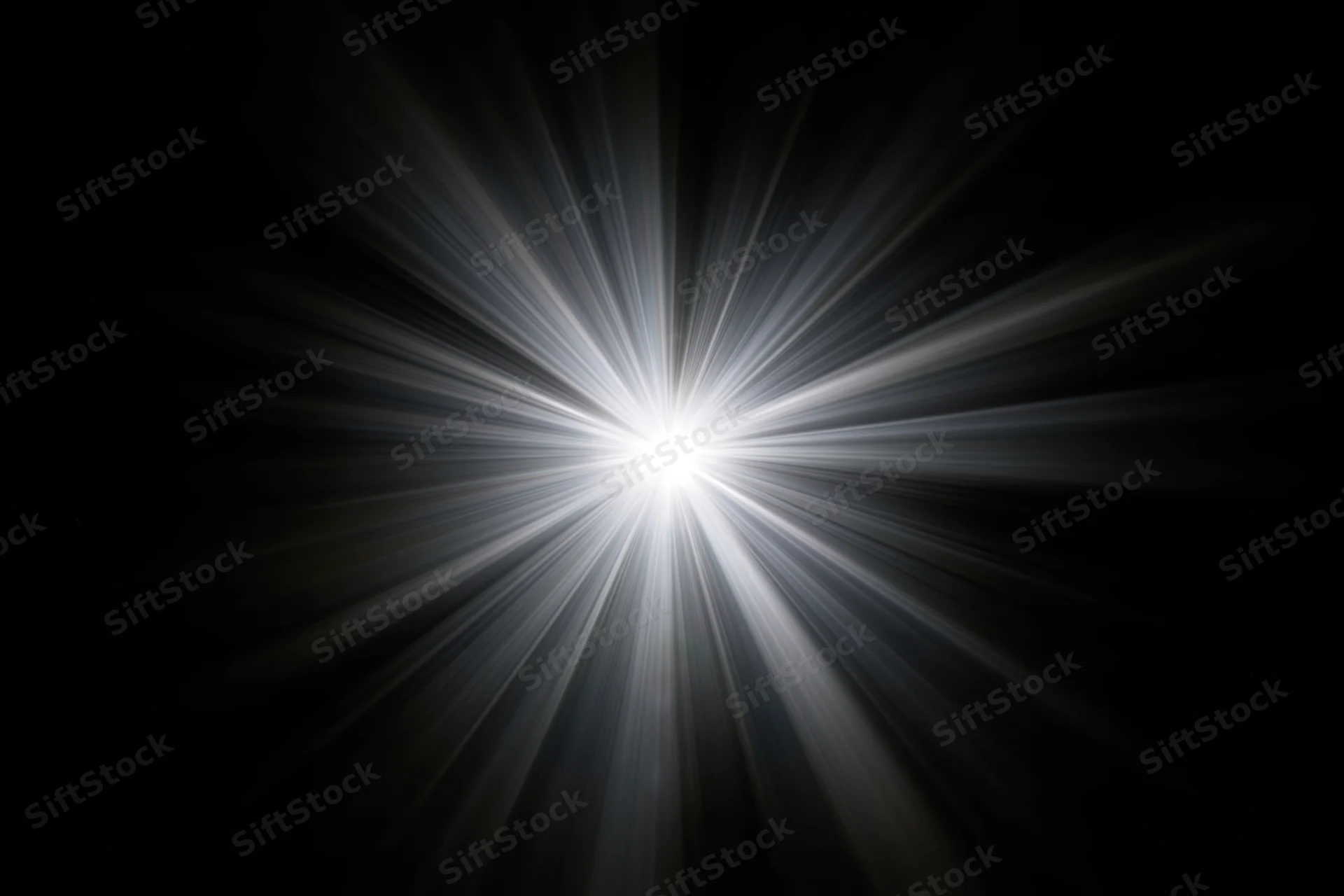 Intense white light burst radiating straight beams outward from center against black background