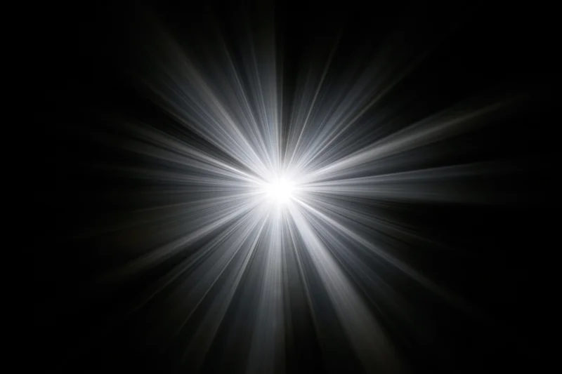Intense white light burst radiating straight beams outward from center against black background