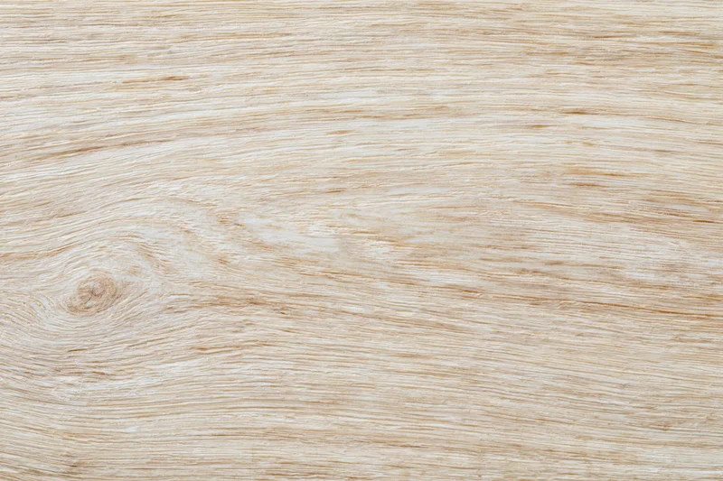 Light blonde wood surface filling the frame in flat lay top view