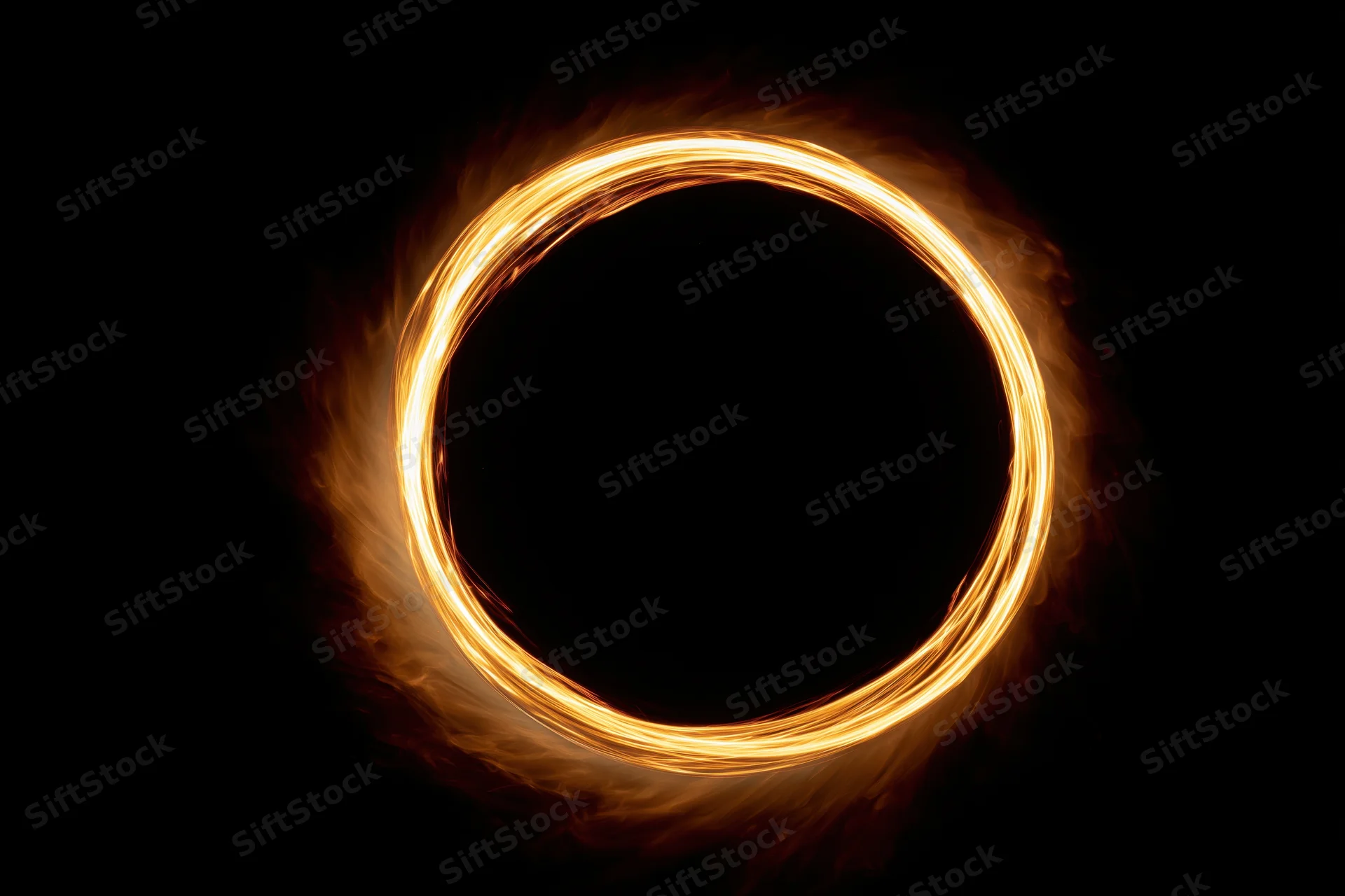 Glowing circular light ring formed by long-exposure light painting against dark background