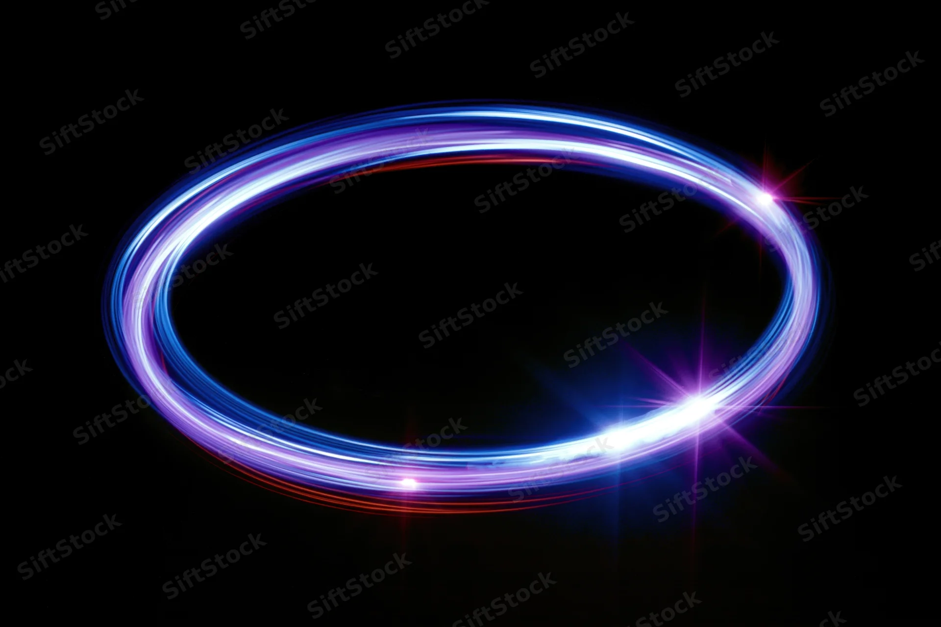 Glowing circular light trail forming a ring against a dark background with copyspace