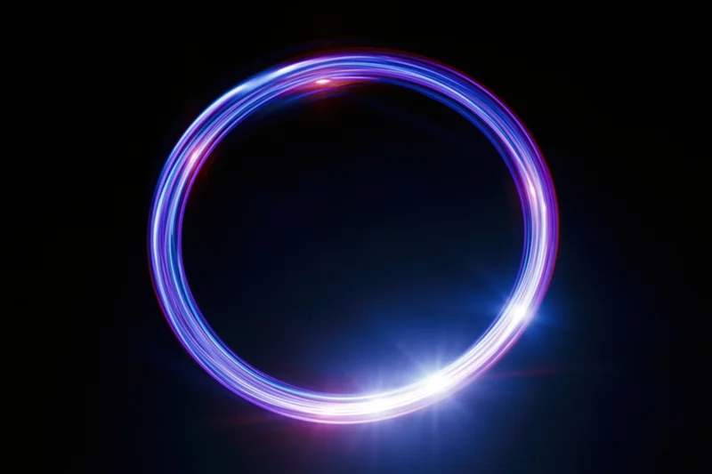 Glowing circular light ring formed by long-exposure light painting against dark background