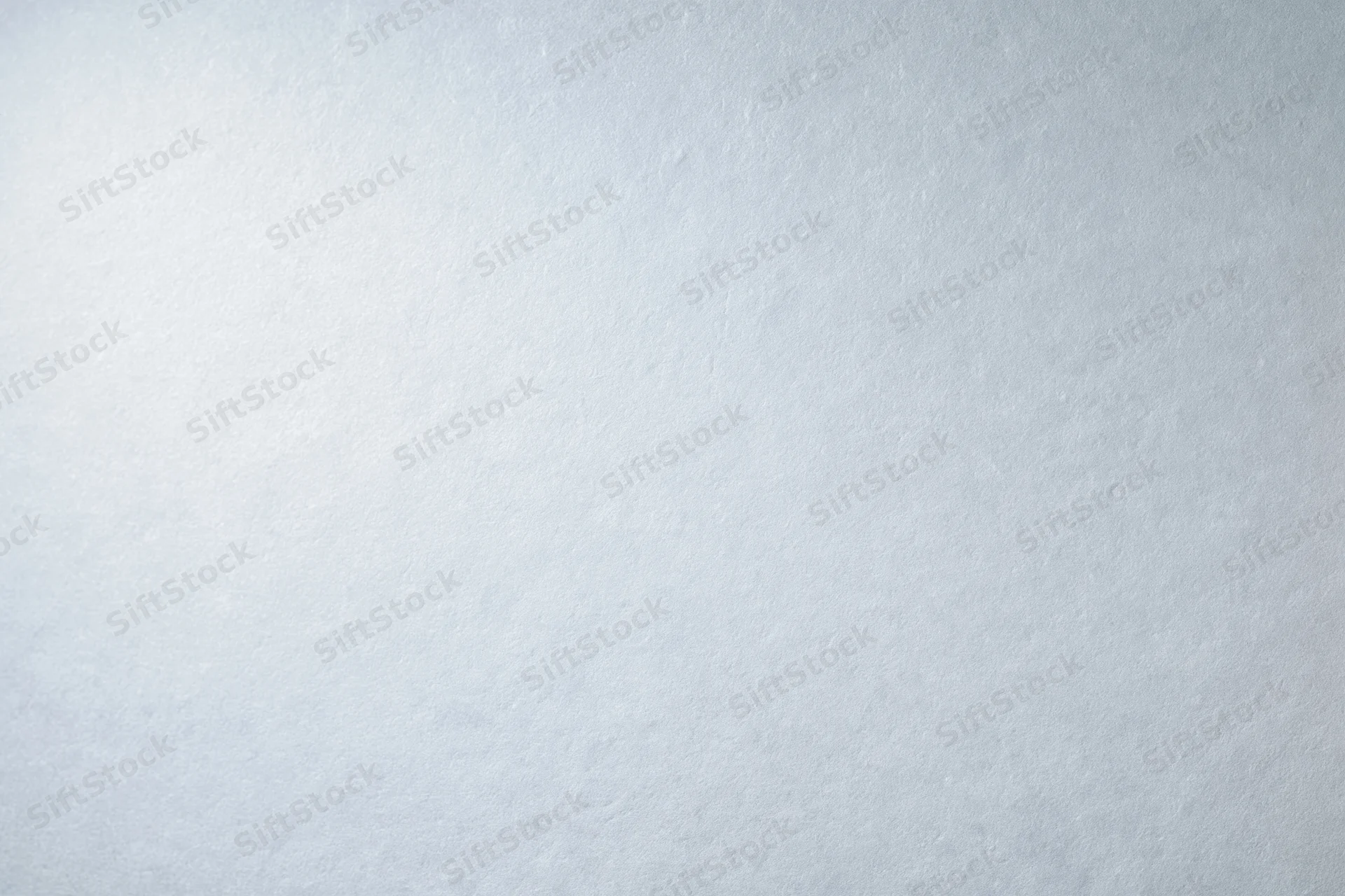 Plain white-grey gradient studio backdrop with subtle texture and copyspace