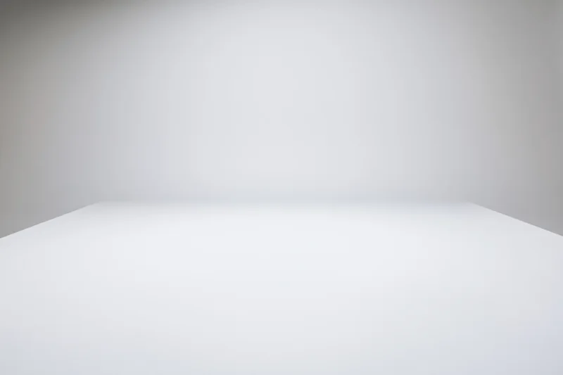 Empty white studio space with gradient background and copyspace for product display