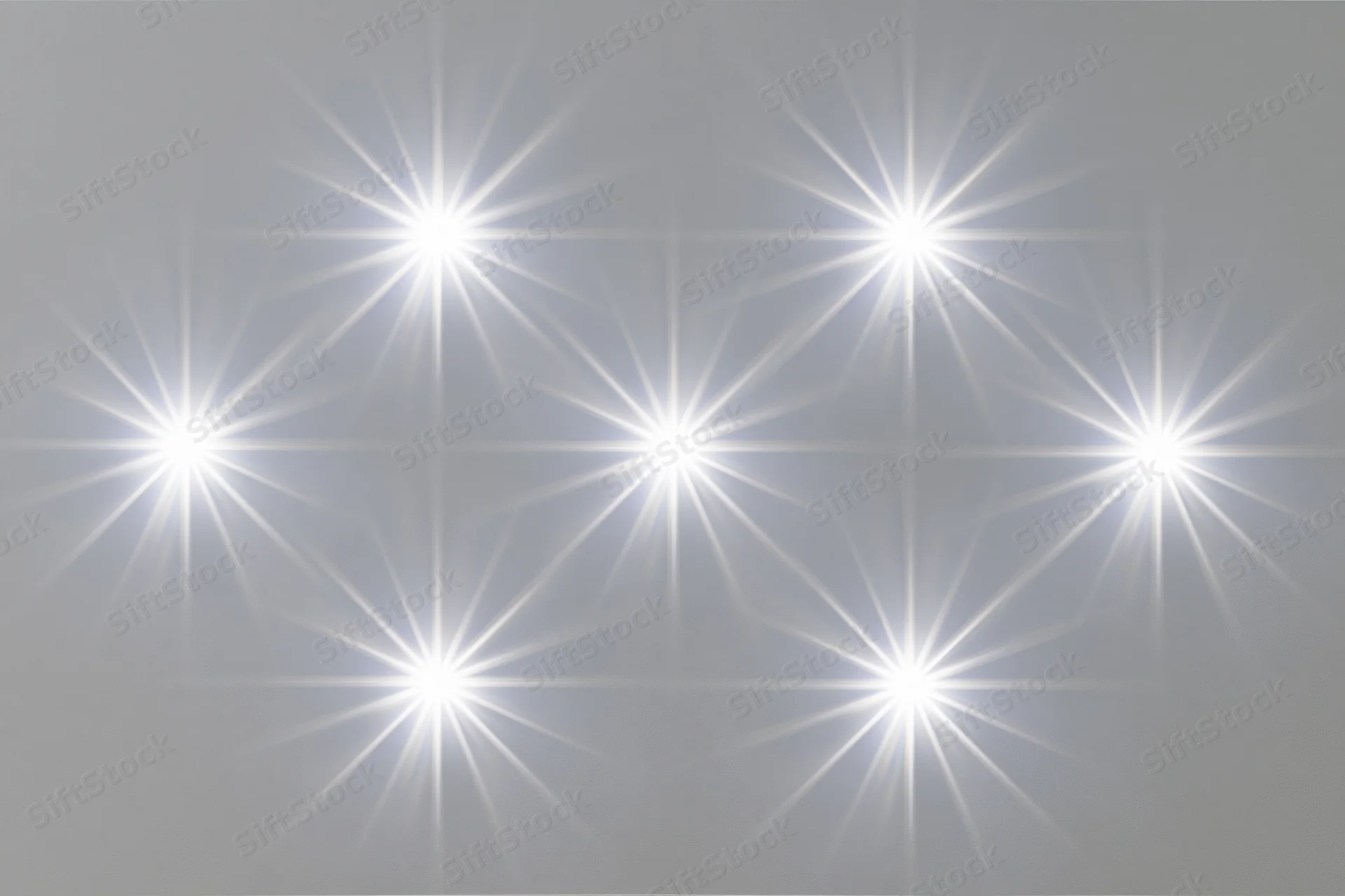 Six bright white lens flare star bursts arranged in two rows on a neutral gray background