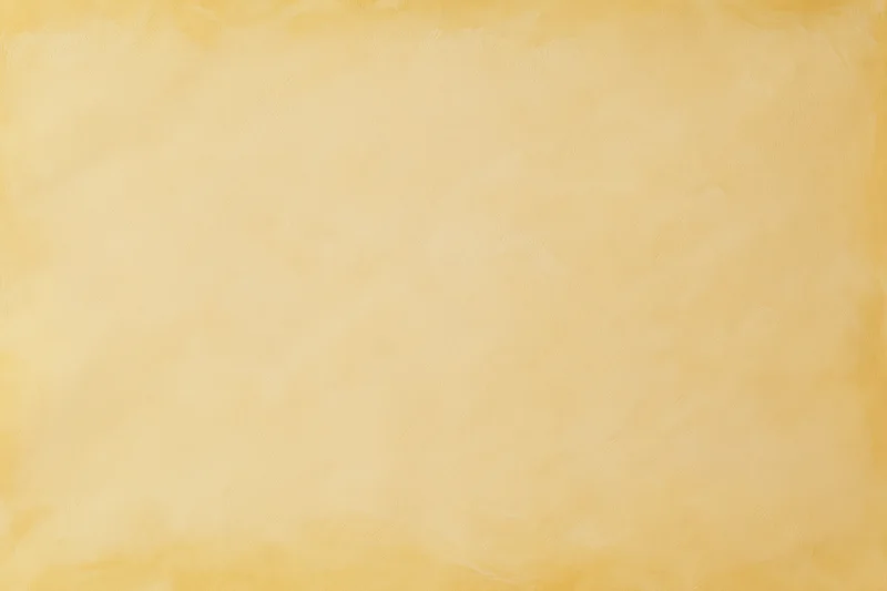 Smooth beige studio backdrop wall filling the frame with even lighting and no subject