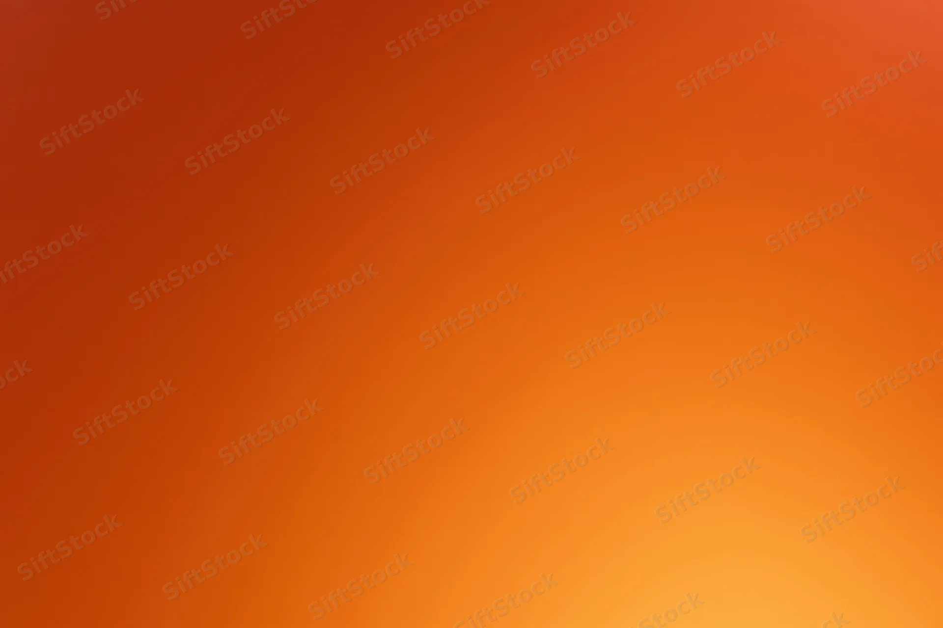 Smooth gradient background transitioning from deep red-orange to bright orange