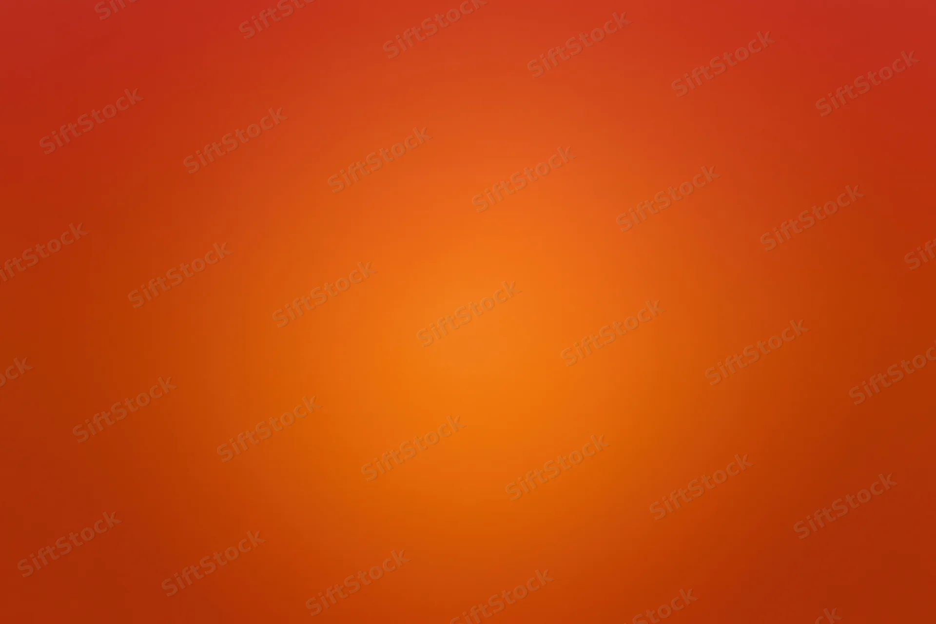 Smooth radial gradient transitioning from deep red-orange at edges to bright orange center